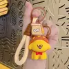Líneas creativas de dibujos animados muñeco perrito llavero lindo colgante de muñeca coche bolsa pareja regalo pequeño venta al por mayor