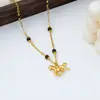 Nuevo Collar con Colgante de Caballo Dorado Estilo Retro Chino con Cuentas de Piedra Ojo de Tigre para Mujer, Cadena de Clavícula Versátil y Elegante con un Toque de Alta Gama