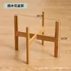 Estante de flores de cuatro patas para suelo estante de flores de madera maciza maceta para suculentas bandeja de bambú productos de madera de bambú directos de fábrica hogar