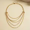 Collar de borlas con cuentas de perlas artificiales multicapa europeo y americano, cadena para la clavícula personalizada de nicho transfronteriza, accesorio versátil de moda de alta gama