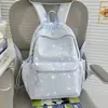 Nuevo modelo 2026 mochila casual estampada estilo ins para estudiantes de secundaria y primaria, mochila ligera de gran capacidad para ir a la escuela para niñas
