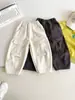 Valle del Viento 2026 Invierno Nuevos Pantalones Cargo Personalizados de Estilo Japonés para Niños con Bolsillos Grandes, Elegantes Pantalones Anchos Forrados de Forro Polar para Niños