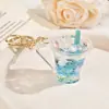 Copo de chá de leite iceberg de cristal garrafa flutuante chaveiro luminoso criativo pingente de mochila para copo de chá de leite boneca presente atacado