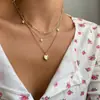 Collar de doble anillo con forma de corazón incrustado con diamantes de imitación, estilo cruzado de gran venta para mujer, cadena para clavícula de aleación ins, diseño de nicho, sentido de diseño, lujo ligero de nicho