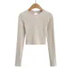 Chica atractiva cuello redondo elástica ajuste ceñido Sexy espalda descubierta con tiras cruzadas manga larga Camiseta corta ajustada para mujer