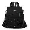 Mochila de moda transfronteriza para mujer 2026 nuevo modelo simple de nylon antirrobo elegante para viajes multiusos bolsa escolar