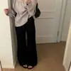 Foto real de los nuevos jeans acampanados de lavado simple de alta gama para mujer de Dongdaemun, Corea, otoño 2026