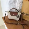 Bolsa Mini Exquisita de Bollo de Verano de Nicho para Mujer 2026 Nueva Bolso de Hombro Tejido de Paja Bolso Cruzado para Vacaciones en la Playa