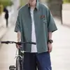 Camisa elegante de manga corta para hombre, nueva marca de moda de verano 2024, diseño moderno, camisa de siete mangas a rayas con estilo Sense Niche