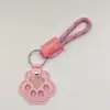 Novo pingente memorial criativo para guardar pelos de pet, porta-cartão de acesso à porta anti-perda, pingente de chaveiro de pata de cachorro