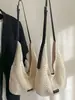 Bolso de mano tejido de nicho para mujer Primavera 2026 Transfronterizo, Bolso de playa casual de moda para hombro cruzado