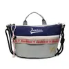 Bolsas para Mulheres 2025 Nova Bolsa de Lona Três Cores Moda Casual Versátil Americana Combinação de Cores Bolsa de Ombro Bolsa Transversal para Mulheres