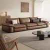 Sofá de cuero genuino, estilo retro minimalista italiano, adecuado para salas de estar y oficinas modernas, con un diseño de líneas rectas y tapicería en forma de nube