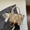 Bolsa cesta de vegetais com textura trançada feminina 2026 nova alta personalidade bolsa de ombro único transversal bolsa de mão com sensação relaxada bolsa balde