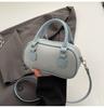 Bolsa de Bolos Portátil de Nicho para Mujer Verano 2026 Nueva Moda Bolso con Carcasa Texturizada Versátil Bolso de Hombro Cruzado