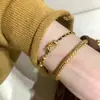 Anillo Corredor Dorado de Explosiones de Libro de Caperucita Roja Pulsera de Oro Negro Cadena Estilo Chanel Simple y a la Moda para Mujer Cuerda de Mano Trenzada Flash Cepillada