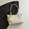 Bolso de mujer tejido en relieve estilo europeo y americano, nuevo modelo 2026, bolso de hombro y axila, bolso tote de moda para commuting, bolso artístico para madre e hija