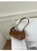 Bolso de axila tipo baguette de diseño único para mujer, nuevo bolso de mano versátil y elegante de moda 2024, bolso de hombro de alto valor estético