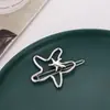 Nuevos accesorios de moda para mujer europeos y americanos accesorios irregulares para el cabello tocado estrella de mar hueca brillante pasador