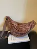 Bolso súper popular de nicho con estampado de leopardo para mujer, nuevo bolso cruzado de moda versátil 2026, exquisito mini bolso de cuerno, bolso tipo empanada