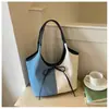 Bolso tote de gran capacidad para mujer, nuevo modelo de verano 2025, bolso simple casual para el hombro estilo ins, bolso versátil de moda para mujer