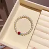 Nuevo brazalete de perlas con cuentas exquisitas de estilo chino, pulsera de diseño de nicho de lujo ligero, accesorio de mano versátil para el día a día al por mayor