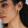 Europa y Estados Unidos aretes de tuerca triangulares dobles huecos con diseño creativo de personalidad y baño de latón dorado real caliente transfronterizo
