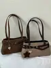 Bolsa de ombro estilosa estilo moto para mulheres, novo modelo 2026, bolsa de mão para o dia a dia, pequena bolsa tote para sair para o trabalho, bolsa baguette