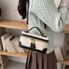 Bolsa de mão color blocking de nicho estilo coreano para mulheres, nova tendência 2026 moda luxo leve bolsa pequena quadrada de ombro e transversal