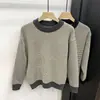 Suéter de punto grueso de cuello redondo nuevo para hombre de Primavera y Otoño, suéter a cuadros versátil, de manga larga ajustado, moda