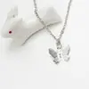 Moda Europea y Americana Colgante de Mariposa y Estrella Collar de Oro para Mujer Cadena Cruzada Plana Prensada Versátil Lote de Productos