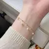 Pulsera de perlas de doble capa elegante popular transfronteriza europea y americana, pulsera de cuentas doradas de diseño simple de alta gama de moda