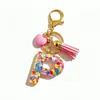 Llavero de Resina Rosa con Lentejuelas y Letras de Alta Venta Transfronteriza, Accesorio Colgante para Bolso con Borla en Forma de Corazón