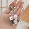 Llavero de Botella de Arena Líquida Negro Dorado Rellena de Aceite Acrílico de Moda Accesorio Colgante de Bolsas de TV de Conejito Lindo de Dibujos Animados