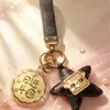 Regalos pequeños y prácticos para el Festival de Medio Otoño: campanilla de conejo rosa, moneda de la fortuna, llavero de pastel de luna, recuerdos promocionales corporativos
