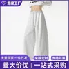 Pantalones deportivos versátiles de calle americanos transfronterizos para hombre y mujer, pantalones deportivos de pierna ancha con retazos de marca de moda, pantalones rectos casuales holgados de alta resistencia