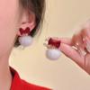 Pendientes de terciopelo rojo con lazo y pompón de felpa Otoño e Invierno 2023 nuevos pendientes populares pendientes únicos de bola de pelo de Navidad para mujer