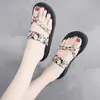 Nuevos zapatos de talla grande para mujer de comercio exterior, sandalias de playa para mujer, ropa exterior para mujer, verano, nuevas chanclas planas Cuihua de punta cruzada, lote