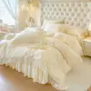 Juego de ropa de cama de cuatro piezas de algodón ligero de lujo estilo francés, funda de edredón estilo princesa con borde de encaje de algodón puro, juego de cuatro piezas con falda de cama de algodón de fibra larga