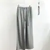 Outono 2026 Novo Estilo Minimalista Japonês Calça de Moletom Versátil com Cordão Cintura Elástica Perna Reta Solta com Decoração de Botão