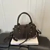 Bolso Cruzado de Hombro Único Moda Remaches Retro para Mujer 2026 Nuevo Estilo Chica Caliente Casual Color Sólido Gran Capacidad Bolso de Mano