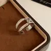 Anillo abierto de doble capa redondo de circonita cúbica de temperamento coreano nicho sensación de alta gama anillo para el dedo índice joyería de mano versátil simple de lujo ligero