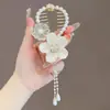 Nuevo clip para el pelo con borla de concha de camelia para coleta, pinza para el pelo con perla y diamantes de imitación, clip para el pelo de alta gama, placa de cabeza esférica, tocado para el pelo