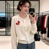 Ropa exterior nueva para mujer de primavera y otoño: un cárdigan de punto pequeño y rojo con cuello redondo, perfecto para usar sobre otras prendas
