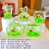 Adorno pequeño de pez marino acrílico, llavero de pez de océano, colgante creativo de botella de arena líquida de pez payaso, decoración de bolsa al por mayor