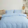 Juego de cuatro piezas de color sólido estilo japonés directo de fábrica, protector de sábana bajera simple cepillado, artículo individual de sábana bajera lavable