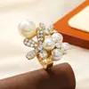 Design de estilo frio francês transfronteiriço Sense Fashion Pearl Diamond Irregular Flower Star Puppy Anel geométrico