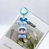 Muñeco de Conejo Llorando Sentado Afelpado Caja Sorpresa Figura Linda Accesorio DIY Llavero Adorno de Escritorio de Resina