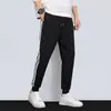 Calça Casual Masculina Primavera e Verão Calça de Moletom com Três Listras Casual Versátil Solta Tamanho Grande Perna Reta Calça Longa Tendência