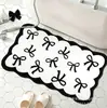 Alfombra linda con forma de lazo de cachemir sintético para uso doméstico en el dormitorio, antideslizante y resistente a la suciedad, alfombrilla de baño suave y absorbente